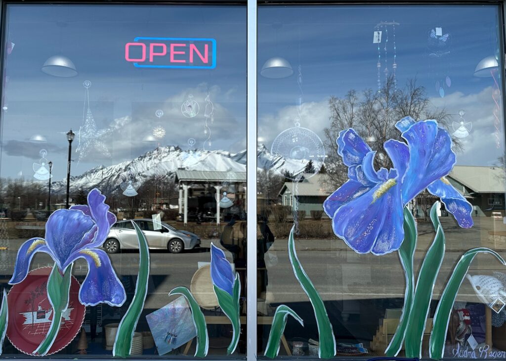 store window with irises painted on it